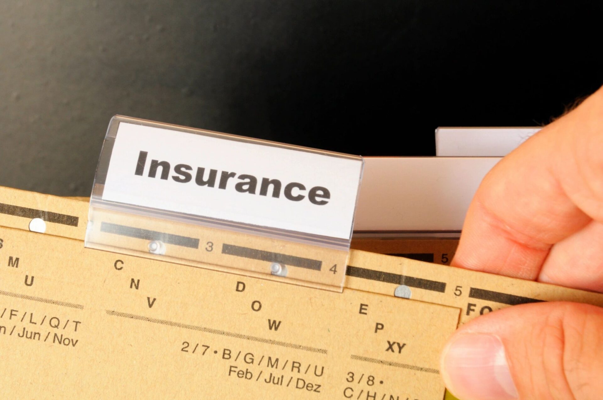 Insurance word on business folder